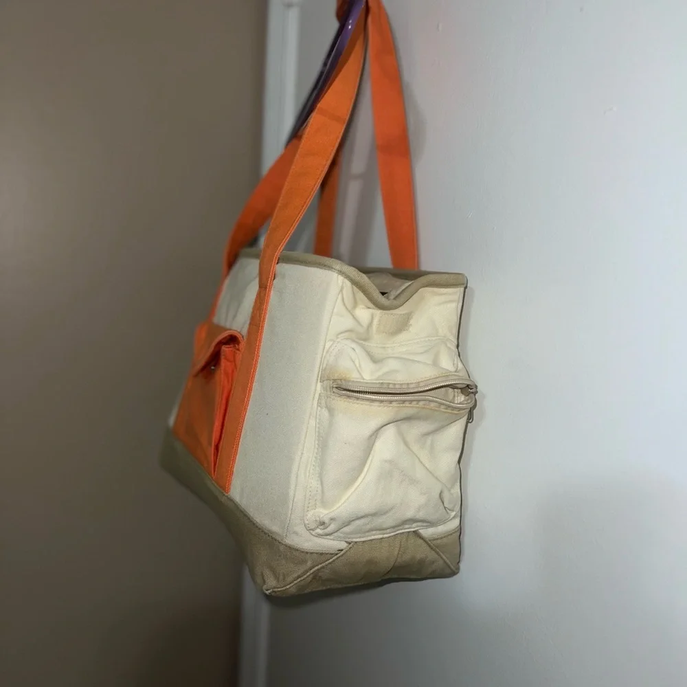 New York dog orange and cream colored dog carrier cold orange small/med